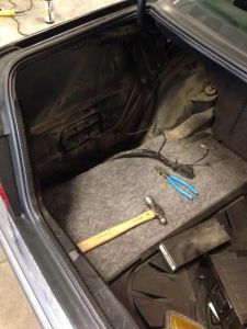 Even the trunk is being sorted out. We are removing the outdated factory cell phone and detailing the trunk. We are also organizing the spare tire and tools back to factory-correct placement.  
